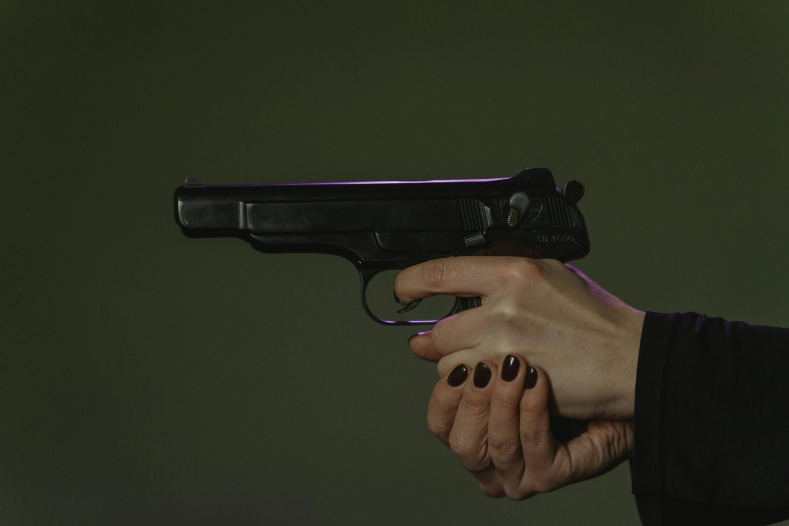 Hand holding gun